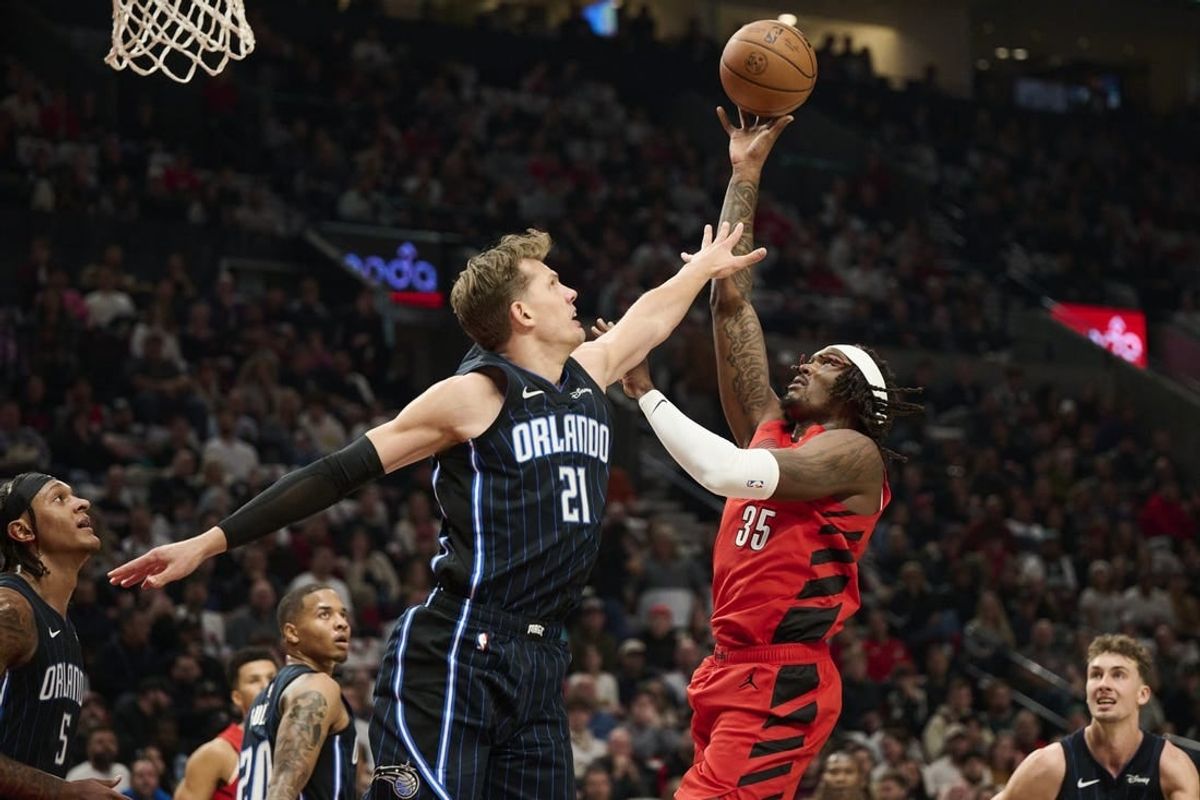 Oct 27, 2023; Portland, Oregon, USA; Portland Trail Blazers center Robert Williams III (35) shoots a basket during the first half against Orlando Magic center Moritz Wagner (21) at Moda Center.
