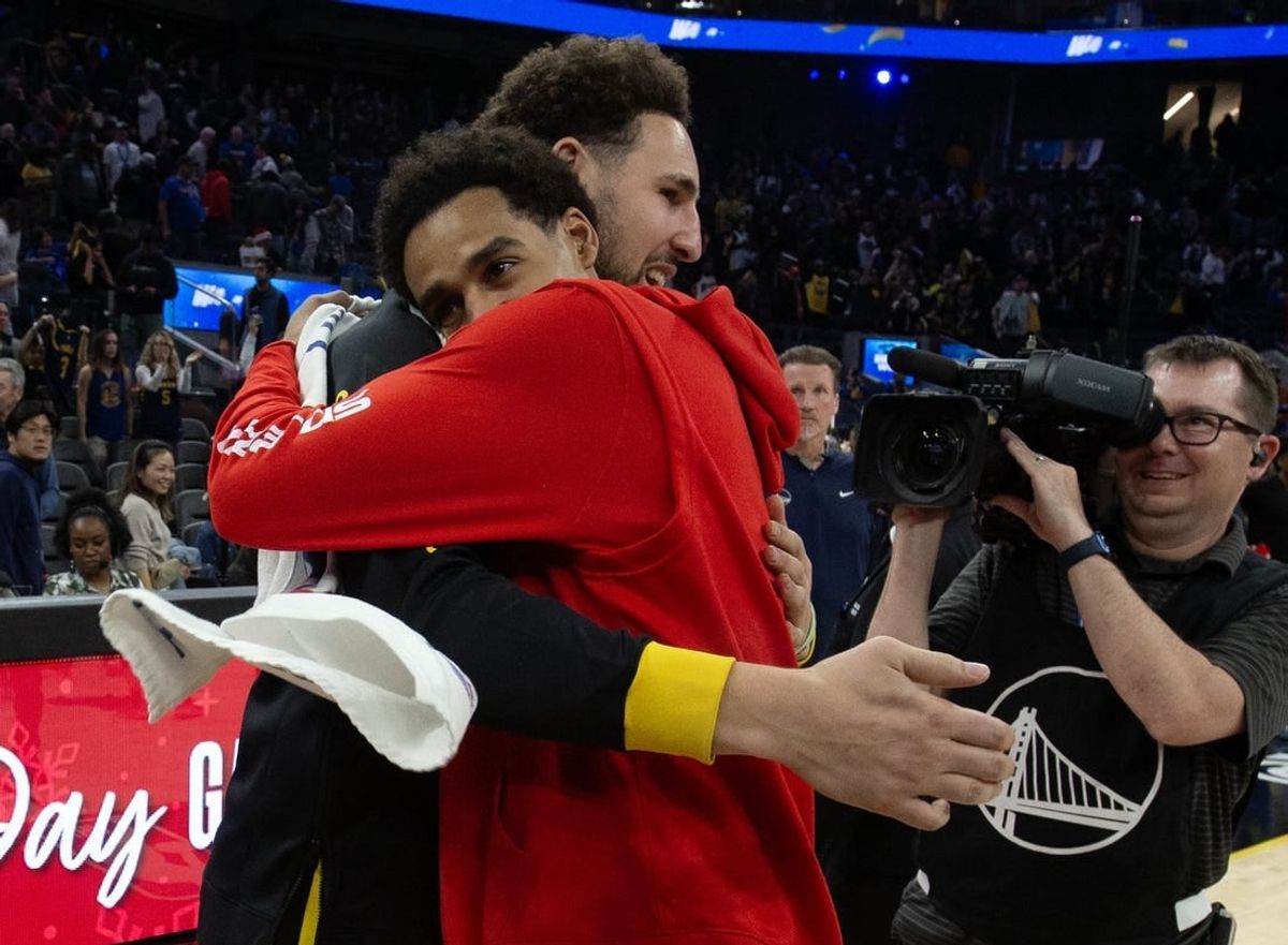 Dec 22, 2023; San Francisco, California, USA; Golden State Warriors guard Klay Thompson (left) embraces former teammate Washington Wizards guard Jordan Poole following their game at Chase Center.