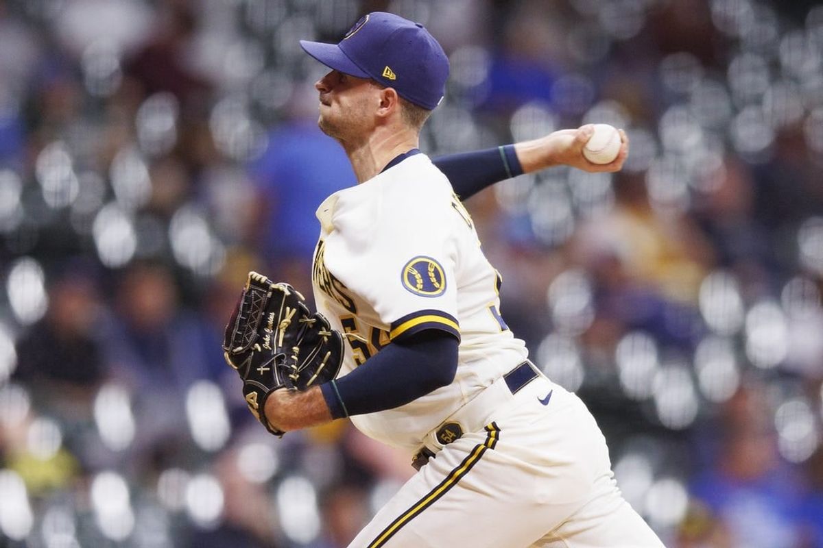 Oct 4, 2022; Milwaukee, Wisconsin, USA;  Milwaukee Brewers pitcher Jake Cousins (54) throws a pitch during the seventh inning against the Arizona Diamondbacks at American Family Field.