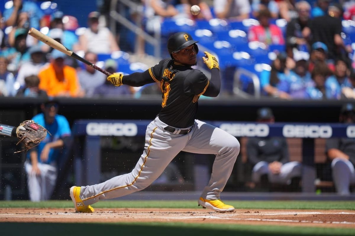 Mar 31, 2024; Miami, Florida, USA;  Pittsburgh Pirates third baseman Ke'Bryan Hayes (13) hits a short ground ball in the first inning against the Miami Marlins at loanDepot Park.