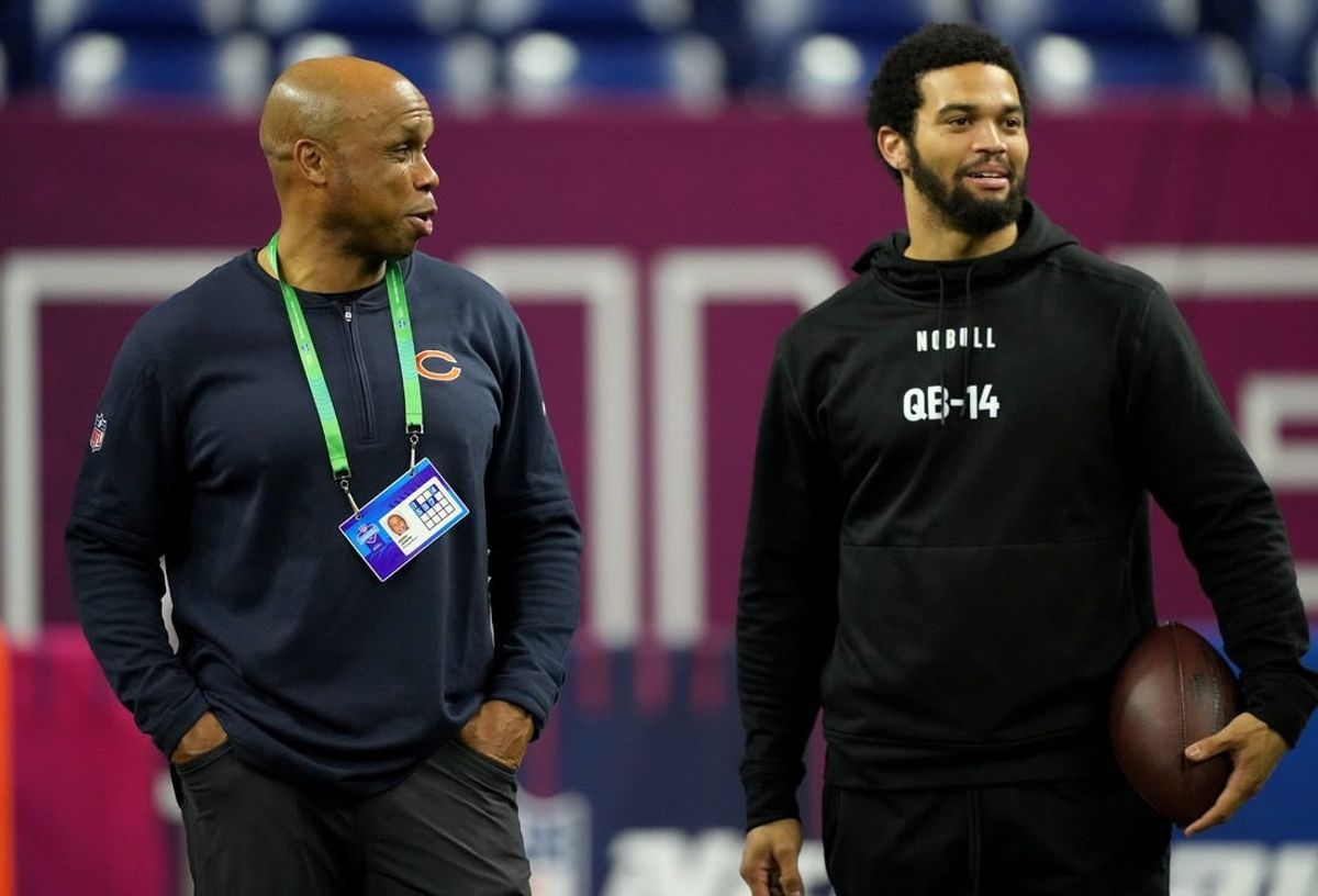 Chicago Bears quarterbacks coach Kerry Joseph talks to Southern California quarterback Caleb Williams (QB14) during the 2024 NFL Combine at Lucas Oil Stadium.