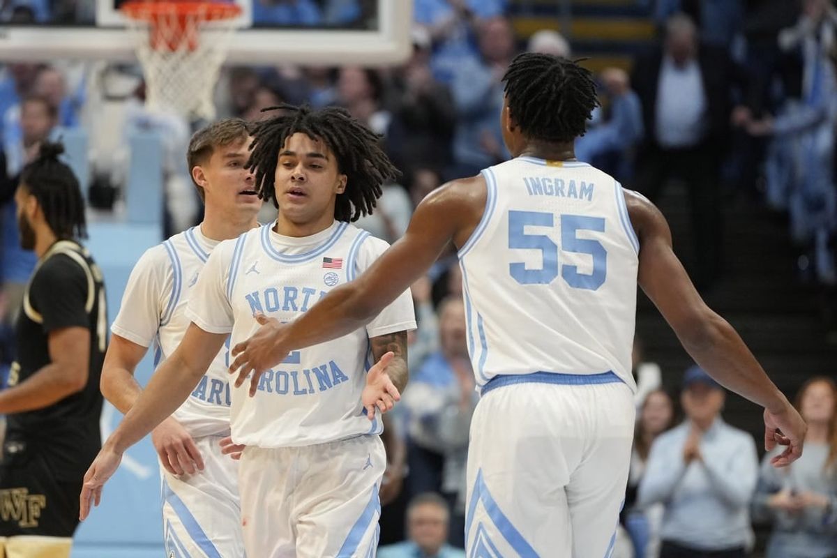 Jan 22, 2024; Chapel Hill, North Carolina, USA;  North Carolina Tar Heels guard Elliot Cadeau (2) with forward Harrison Ingram (55) in the first half at Dean E. Smith Center.