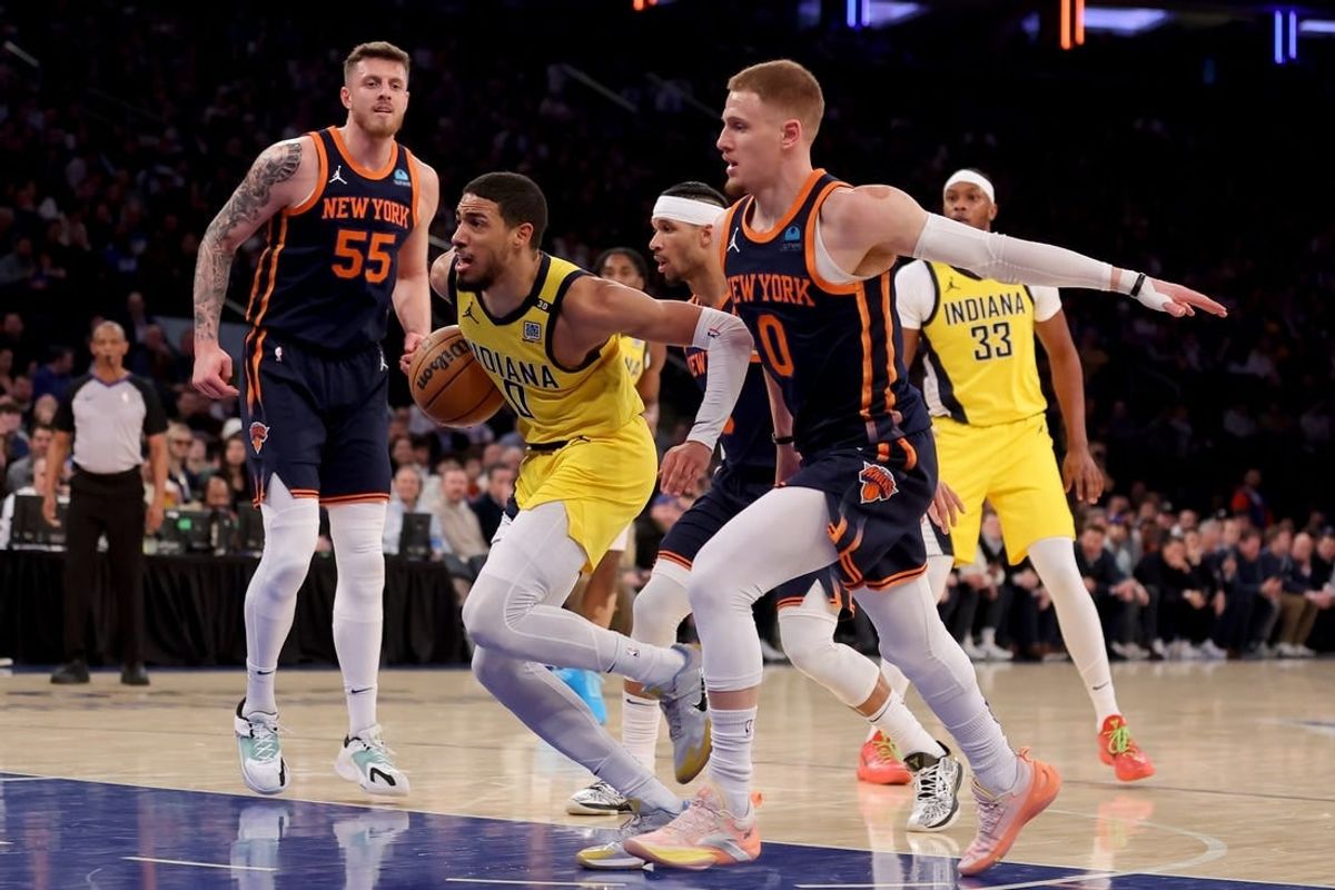Feb 1, 2024; New York, New York, USA; Indiana Pacers guard Tyrese Haliburton (0) drives to the basket against New York Knicks center Isaiah Hartenstein (55) and guards Josh Hart (3) and Donte DiVincenzo (0) during the first quarter at Madison Square Garden.