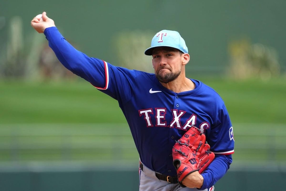 Mar 23, 2024; Surprise, Arizona, USA; Texas Rangers starting pitcher Nathan Eovaldi (17) pitches against the Kansas City Royals during the second inning at Surprise Stadium.