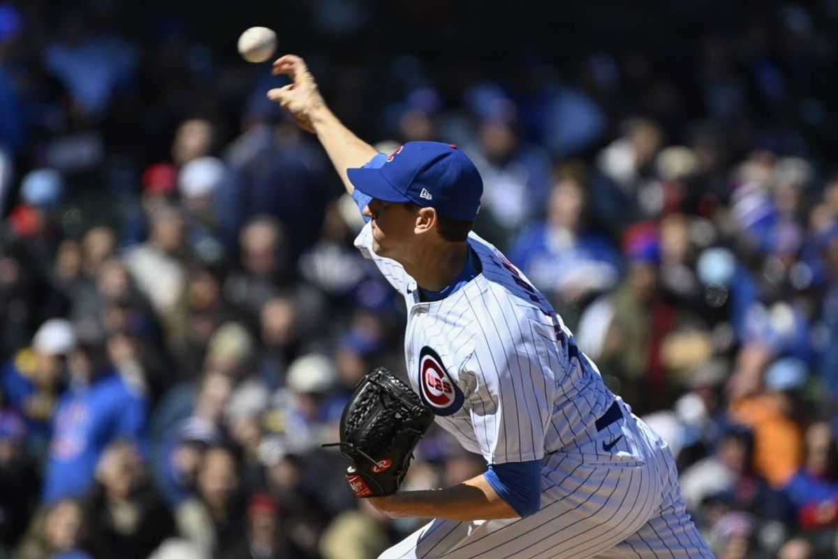 Apr 5, 2024; Chicago, Illinois, USA; Chicago Cubs starting pitcher Kyle Hendricks (28) delivers during the first inning against the Los Angeles Dodgers at Wrigley Field.