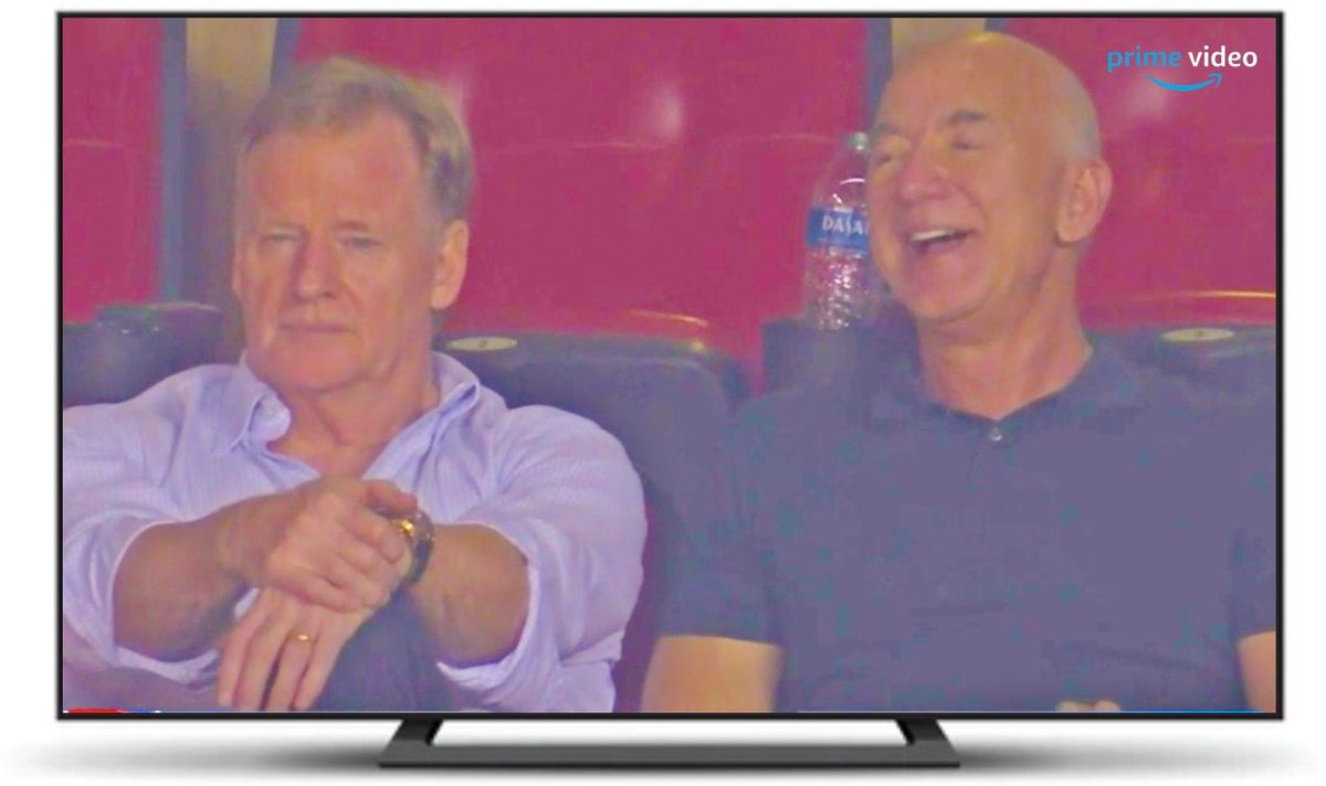 Rog and his billionaire buddy Bezos take in the game