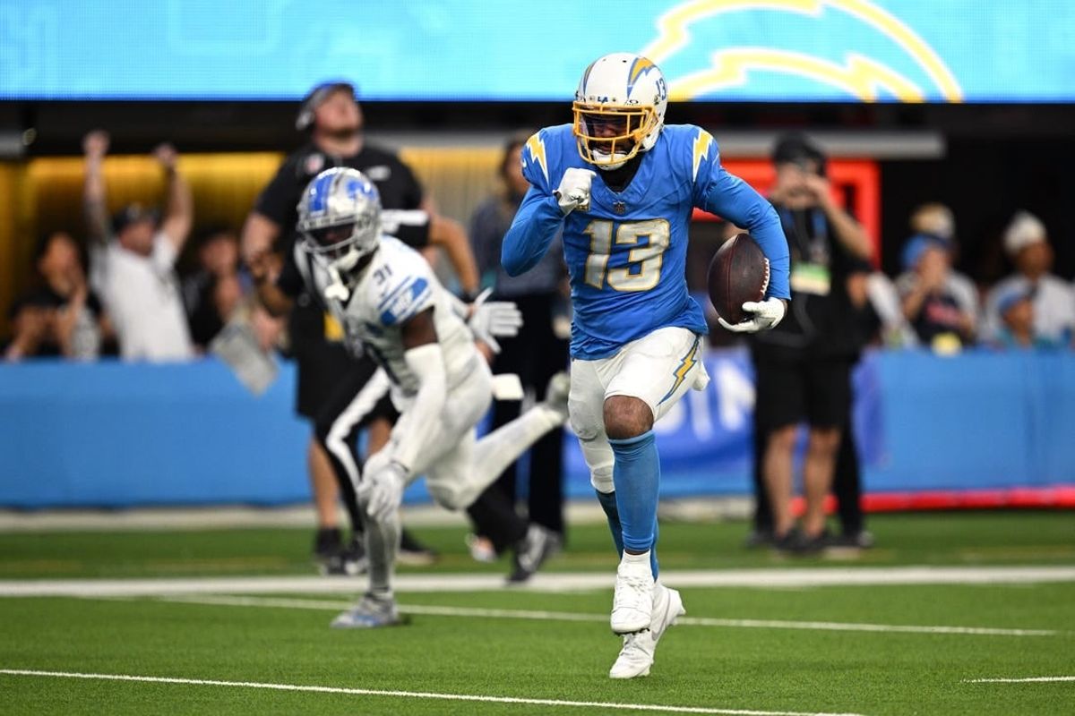 Nov 12, 2023; Inglewood, California, USA; Los Angeles Chargers wide receiver Keenan Allen (13) runs the ball for a touchdown after a catch against the Detroit Lions during the second half at SoFi Stadium.