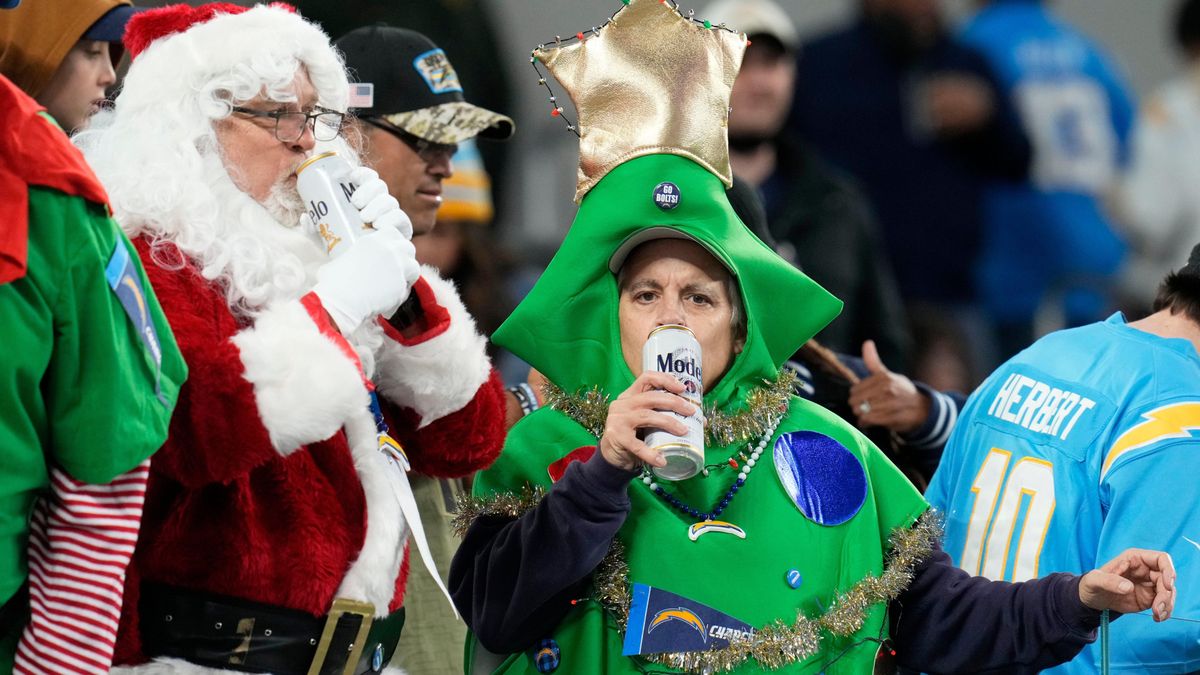 Los Angeles Chargers fans dress for Christmas in the first half of a NFL football game between the Los Angeles Chargers and the Kansas City Chiefs at SoFi Stadium.