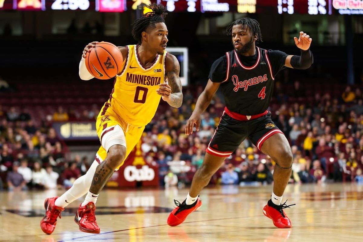 Dec 12, 2023; Minneapolis, Minnesota, USA; Minnesota Golden Gophers guard Elijah Hawkins (0) drives to the basket as IUPUI Jaguars guard Bryce Monroe (4) defends during the first half at Williams Arena.