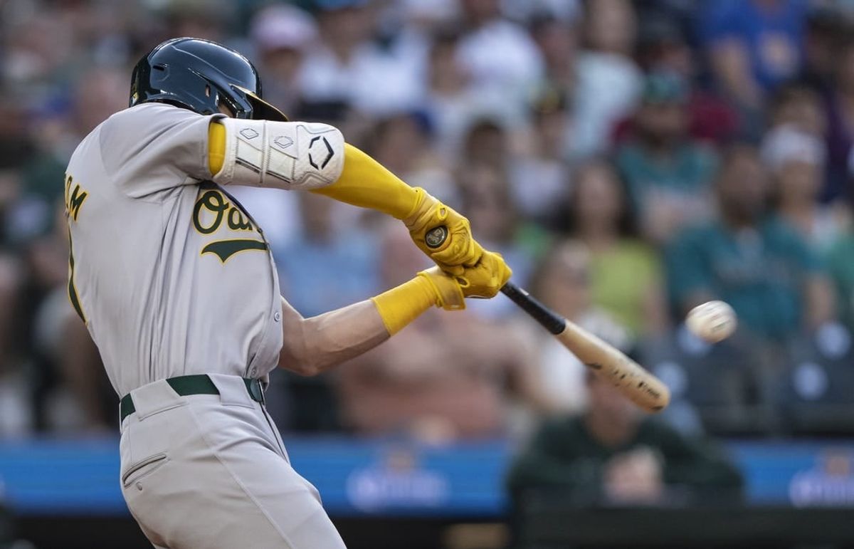 May 11, 2024; Seattle, Washington, USA; Oakland Athletics first baseman Tyler Soderstrom (21) hits a double during the sixth inning against the Seattle Mariners at T-Mobile Park.