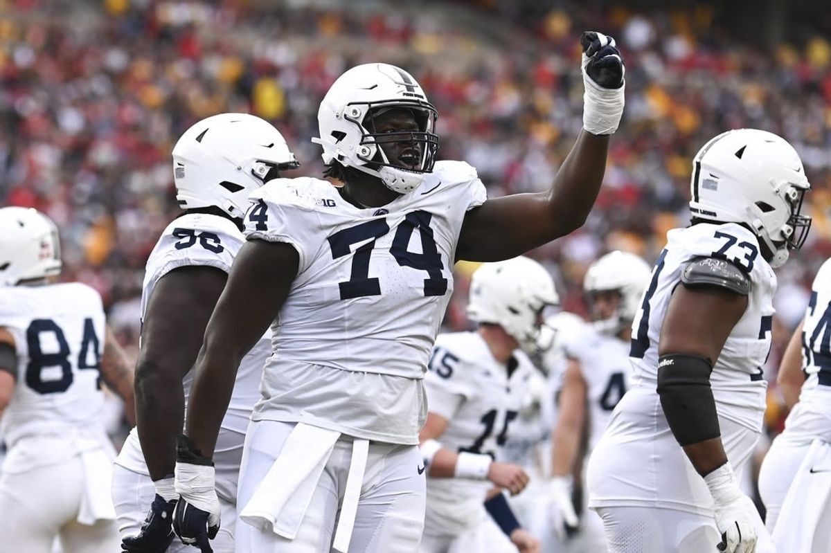 Nov 4, 2023; College Park, Maryland, USA;  Penn State Nittany Lions offensive lineman Olumuyiwa Fashanu (74) celebrates after a first half touchdown against the Maryland Terrapins at SECU Stadium.