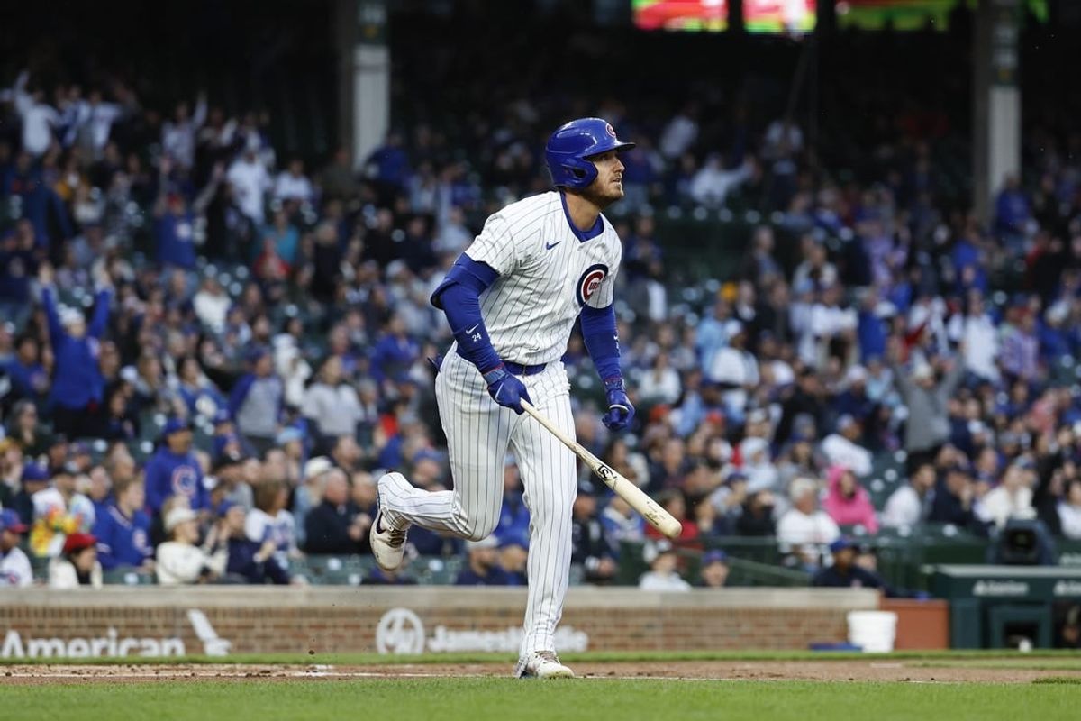 Apr 23, 2024; Chicago, Illinois, USA; Chicago Cubs outfielder Cody Bellinger (24) watches his two-run home run against the Houston Astros during the first inning at Wrigley Field.