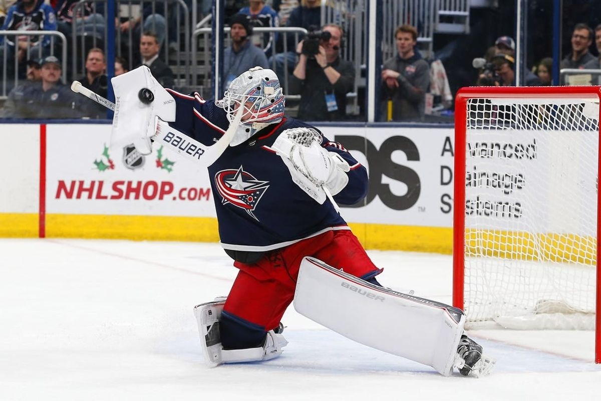 Nov 27, 2023; Columbus, Ohio, USA; Columbus Blue Jackets goalie Spencer Martin (30) makes a blocker save during the first period against the Boston Bruins at Nationwide Arena.