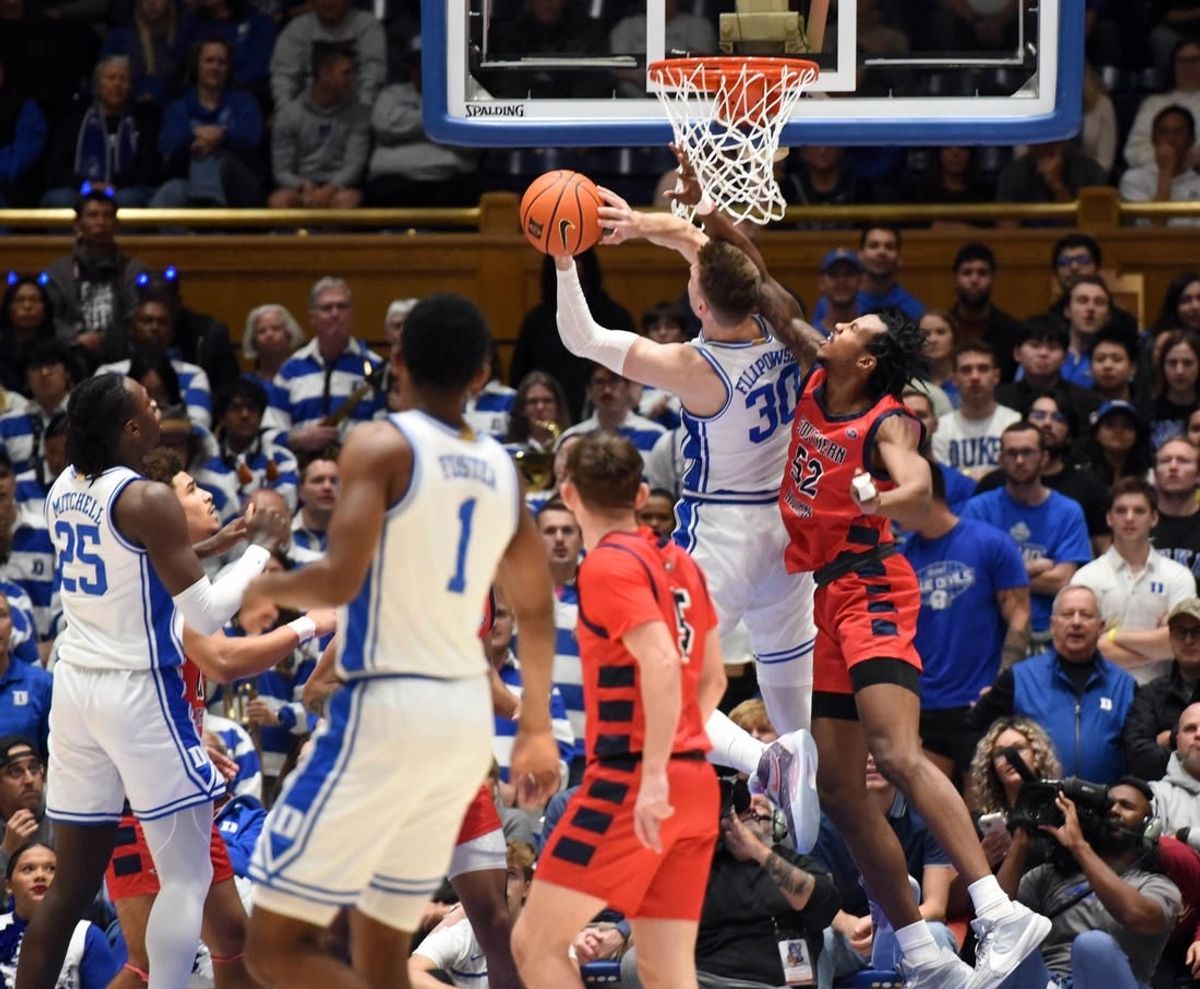 Nov 24, 2023; Durham, North Carolina, USA; Duke Blue Devils center Kyle Filipowski (30) shoots the ball in front of Southern Indiana Screaming Eagles center Kiyron Powell (52) during the first half at Cameron Indoor Stadium.