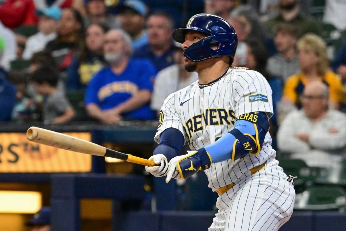 May 11, 2024; Milwaukee, Wisconsin, USA;  Milwaukee Brewers catcher William Contreras (24) hits a double against the St. Louis Cardinals in the first inning at American Family Field.