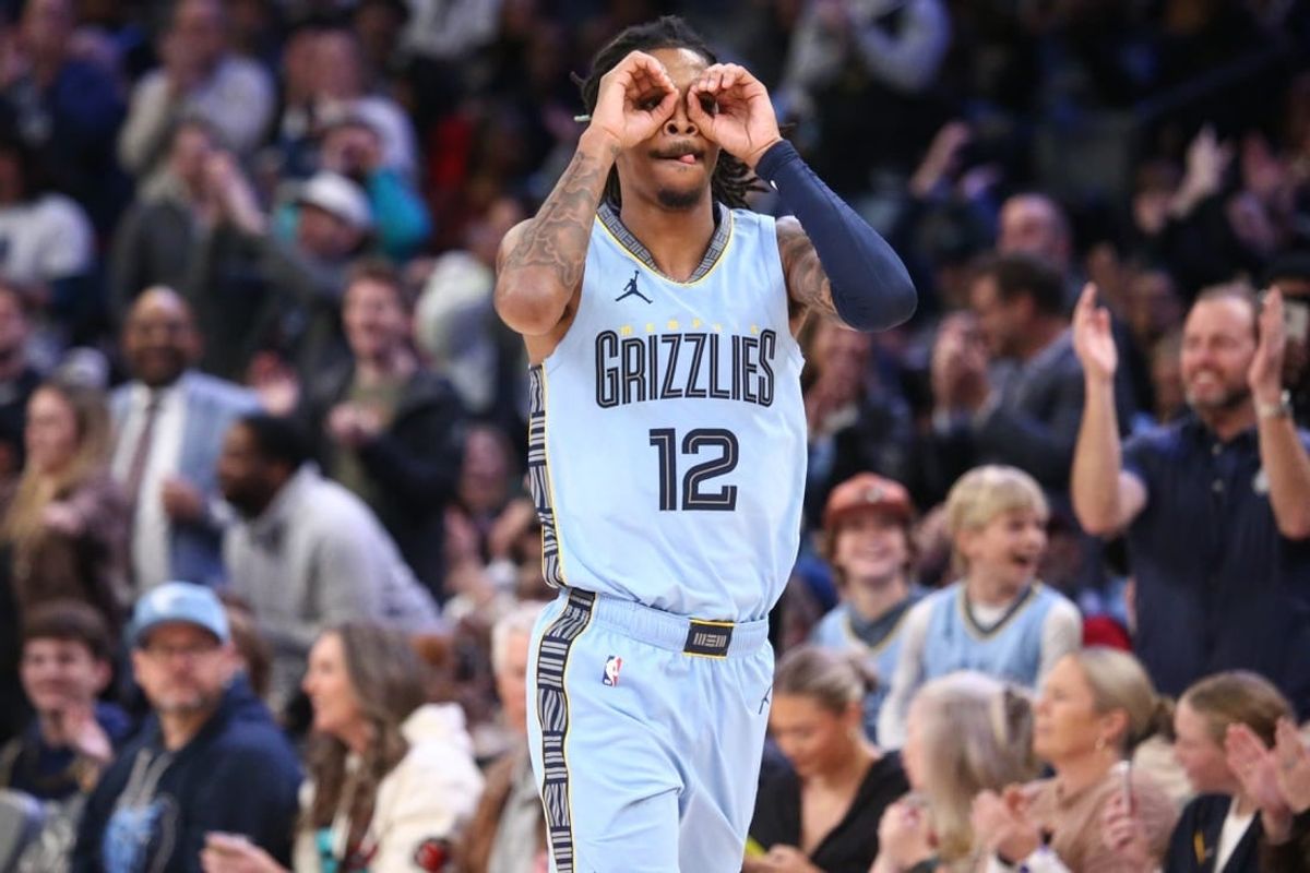 Jan 2, 2024; Memphis, Tennessee, USA; Memphis Grizzlies guard Ja Morant (12) reacts after an assist during the second half against the San Antonio Spurs at FedEx Forum.