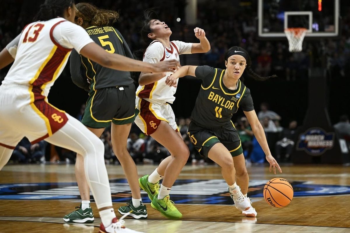 Mar 30, 2024; Portland, OR, USA; Baylor Lady Bears guard Jada Walker (11) drives to the basket during the first half against USC Trojans guard Kayla Padilla (45) in the semifinals of the Portland Regional of the 2024 NCAA Tournament at the Moda Center.