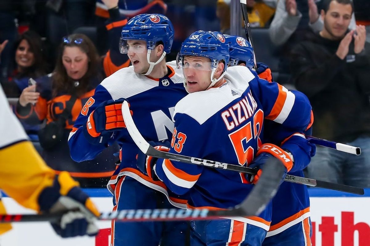 Apr 6, 2024; Elmont, New York, USA; New York Islanders defenseman Noah Dobson (8) celebrates with center Casey Cizikas (53) after scoring a goal against the Nashville Predators during the second period at UBS Arena.