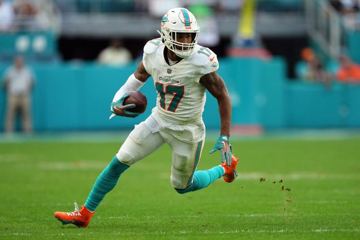 Dec 17, 2023; Miami Gardens, Florida, USA; Miami Dolphins wide receiver Jaylen Waddle (17) runs with the ball against the New York Jets during the second half at Hard Rock Stadium.