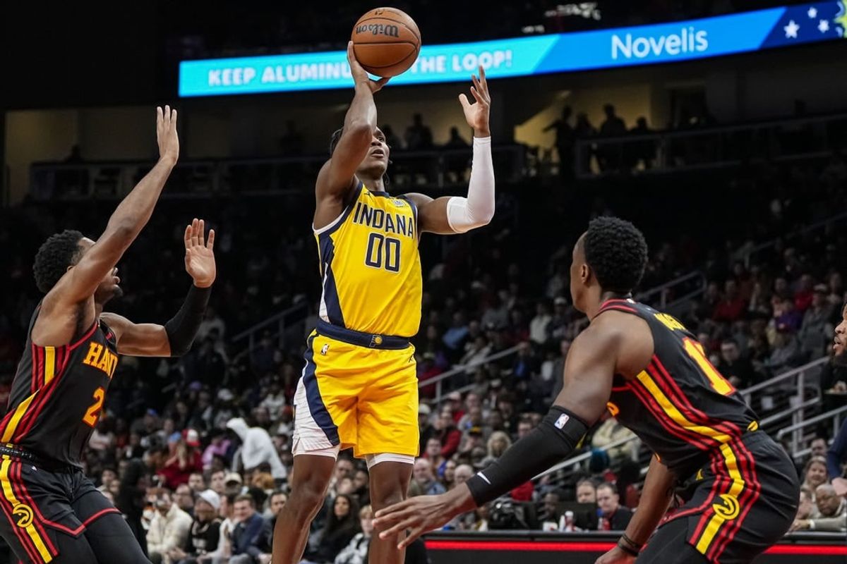 Jan 12, 2024; Atlanta, Georgia, USA; Indiana Pacers guard Bennedict Mathurin (00) shoots over Atlanta Hawks forward Onyeka Okongwu (17) during the first half at State Farm Arena.