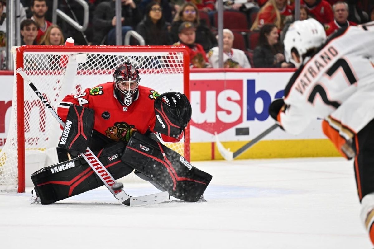 Dec 7, 2023; Chicago, Illinois, USA; Chicago Blackhawks goaltender Petr Mrazek (34) tracks a shot from Anaheim Ducks forward Frank Vatrano (77) in the second period at United Center.