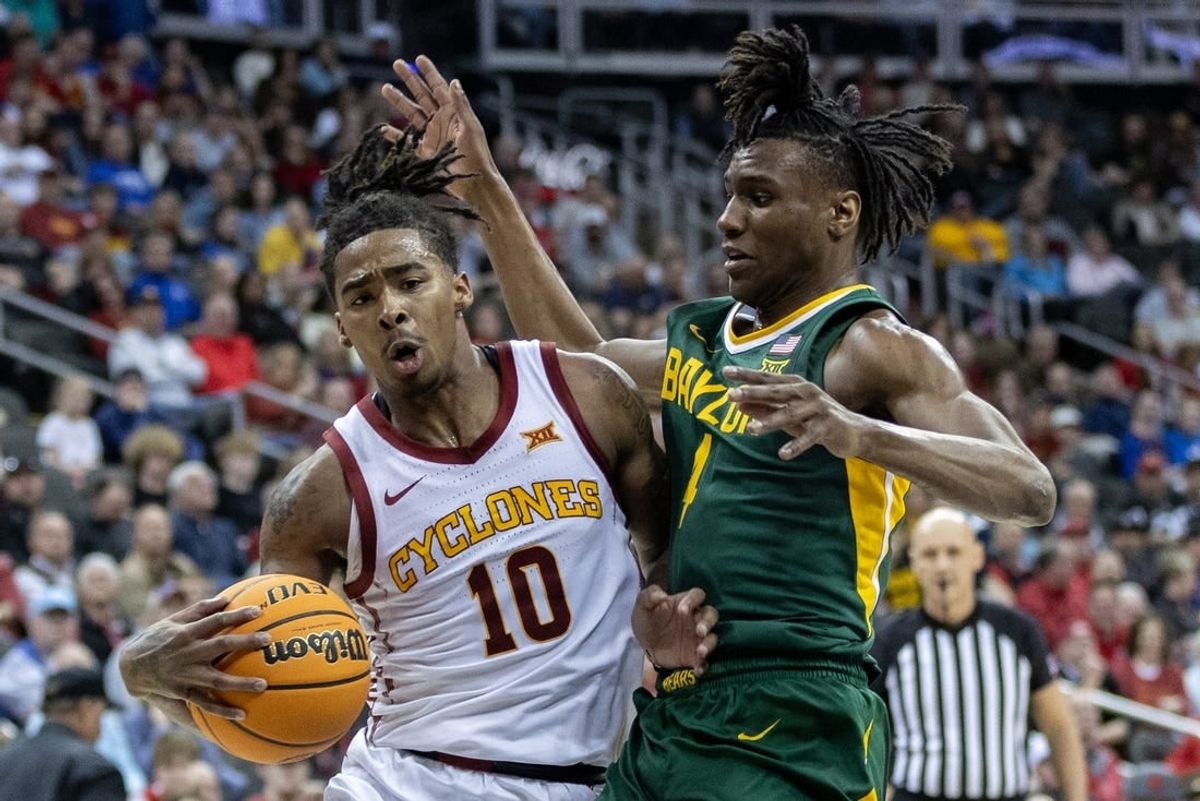 Mar 15, 2024; Kansas City, MO, USA; Iowa State Cyclones guard Keshon Gilbert (10) drives around Baylor Bears guard Ja'Kobe Walter (4) during the first half at T-Mobile Center.