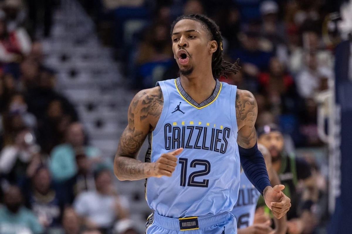 Dec 26, 2023; New Orleans, Louisiana, USA; Memphis Grizzlies guard Ja Morant (12) reacts to a made basket against the New Orleans Pelicans during the first half at Smoothie King Center.