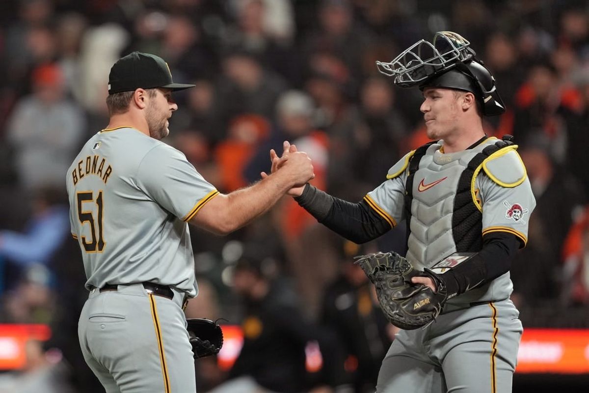 Apr 27, 2024; San Francisco, California, USA; Pittsburgh Pirates pitcher David Bednar (51) celebrates with catcher Henry Davis (right) after defeating the San Francisco Giants at Oracle Park.