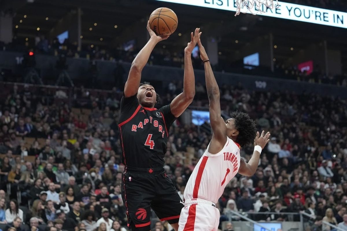 Feb 9, 2024; Toronto, Ontario, CAN; Toronto Raptors forward Scottie Barnes (4) shoots for a basket against Houston Rockets forward Amen Thompson (1) during the first half at Scotiabank Arena.