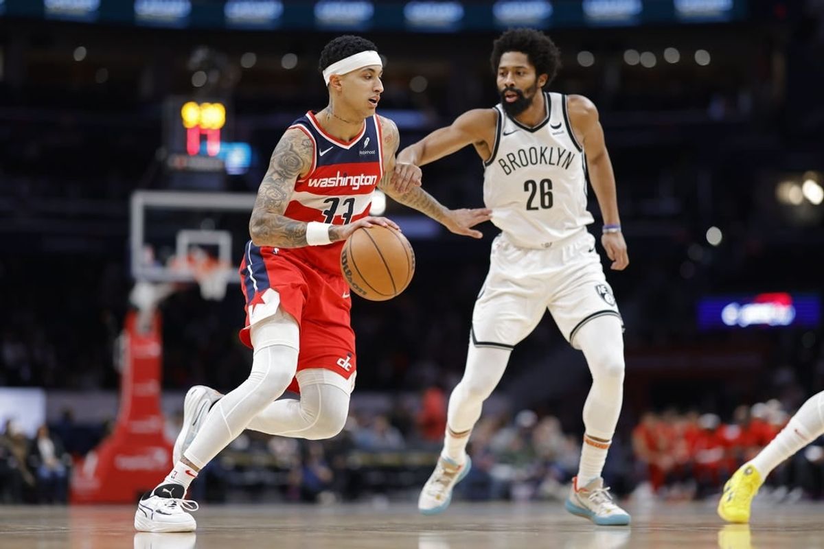 Dec 29, 2023; Washington, District of Columbia, USA; Washington Wizards forward Kyle Kuzma (33) drives to the basket as Brooklyn Nets guard Spencer Dinwiddie (26) defends in the first quarter at Capital One Arena.