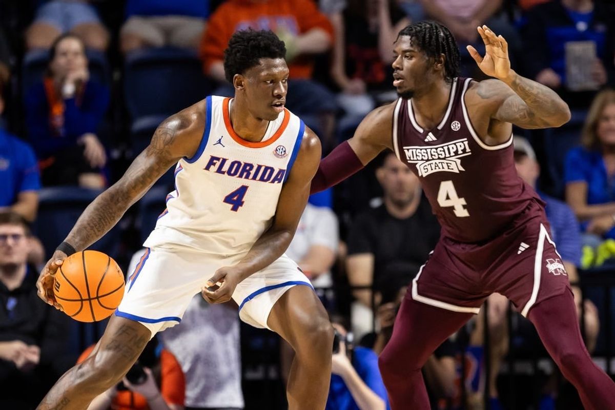 Jan 24, 2024; Gainesville, Florida, USA; Mississippi State Bulldogs forward Cameron Matthews (4) defends Florida Gators forward Tyrese Samuel (4) during the first half at Exactech Arena at the Stephen C. O'Connell Center.