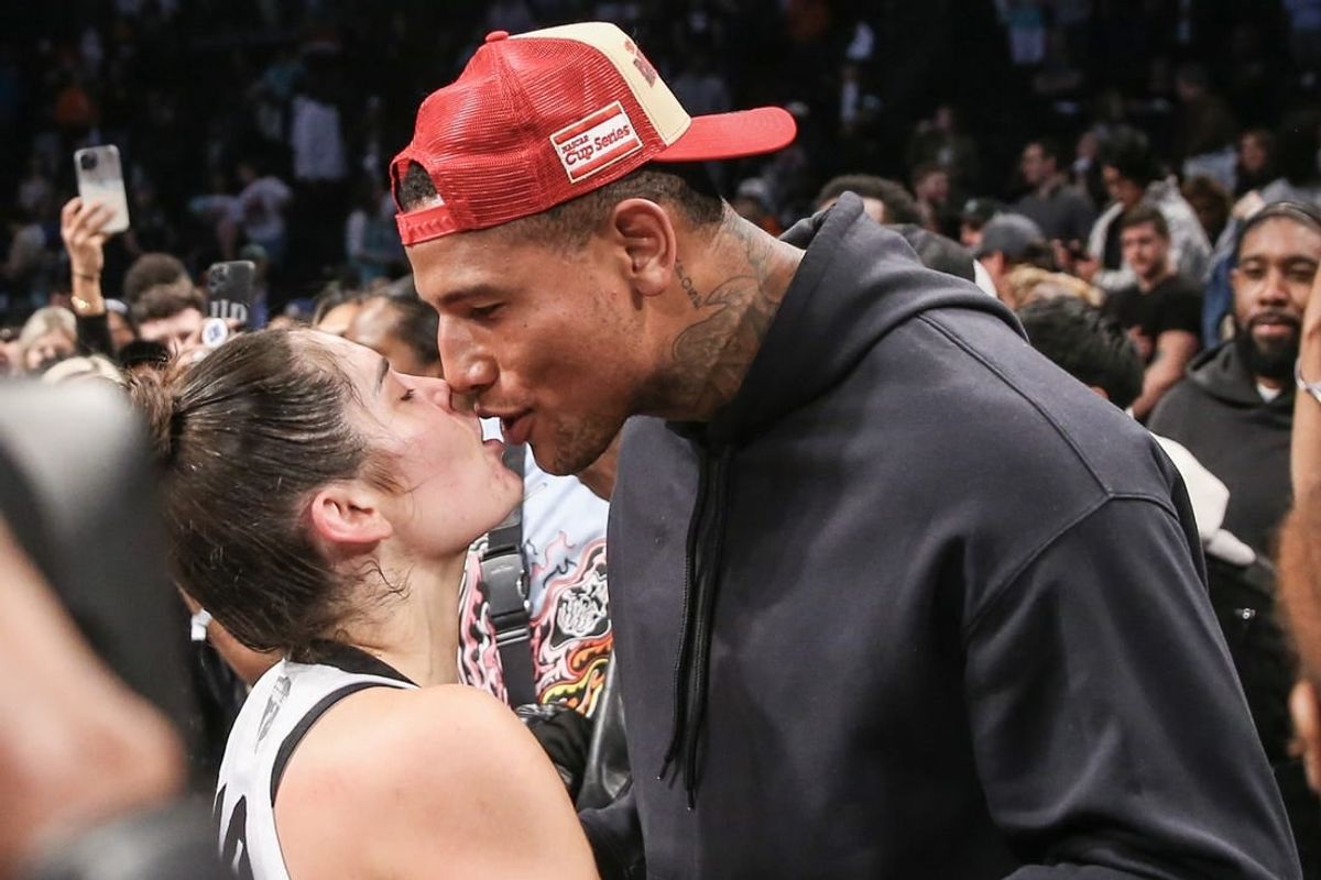 Oct 18, 2023; Brooklyn, New York, USA; Las Vegas Aces guard Kelsey Plum (10) celebrates with her husband, New York Giants tight end Darren Waller, after winning the 2023 WNBA Finals at Barclays Center.