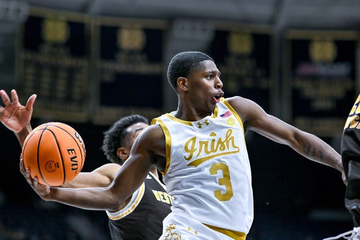 Dec 5, 2023; South Bend, Indiana, USA; Notre Dame Fighting Irish guard Markus Burton (3) passes the ball in the first half against the Western Michigan Broncos at the Purcell Pavilion.