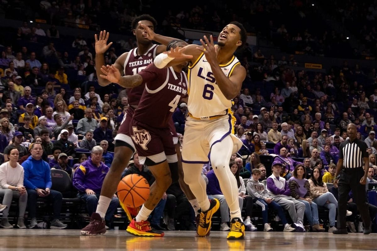 Jan 20, 2024; Baton Rouge, Louisiana, USA;  Texas A&M Aggies guard Wade Taylor IV (4) blocks the shot of LSU Tigers guard Jordan Wright (6) during the first half at Pete Maravich Assembly Center.