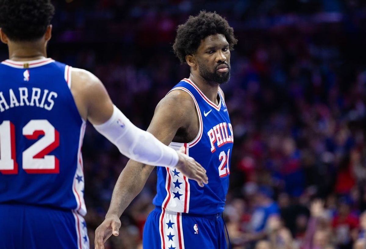 Apr 25, 2024; Philadelphia, Pennsylvania, USA; Philadelphia 76ers center Joel Embiid (21) reacts with forward Tobias Harris (12) after scoring gagainst the New York Knicks during the second half of game three of the first round for the 2024 NBA playoffs at Wells Fargo Center.