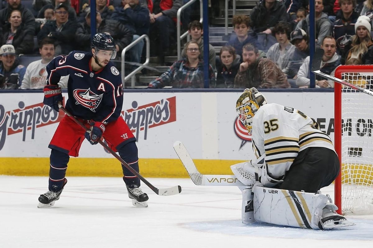 Jan 2, 2024; Columbus, Ohio, USA; Boston Bruins goalie Linus Ullmark (35) makes a save as Columbus Blue Jackets left wing Johnny Gaudreau (13) looks for a rebound during the first period at Nationwide Arena.