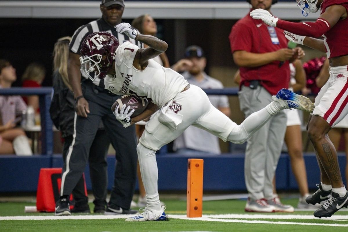 Sep 30, 2023; Arlington, Texas, USA;Texas A&M Aggies wide receiver Evan Stewart (1) scores a touchdown during the game between the Texas A&M Aggies and the Arkansas Razorbacks at AT&T Stadium.