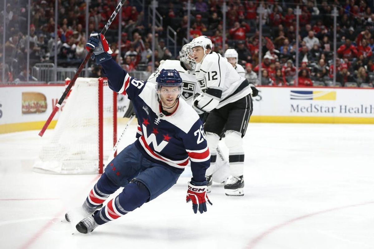 Jan 7, 2024; Washington, District of Columbia, USA; Washington Capitals right wing Nic Dowd (26) celebrates after scoring a goal past Los Angeles Kings goaltender Cam Talbot (39) during the second period at Capital One Arena.