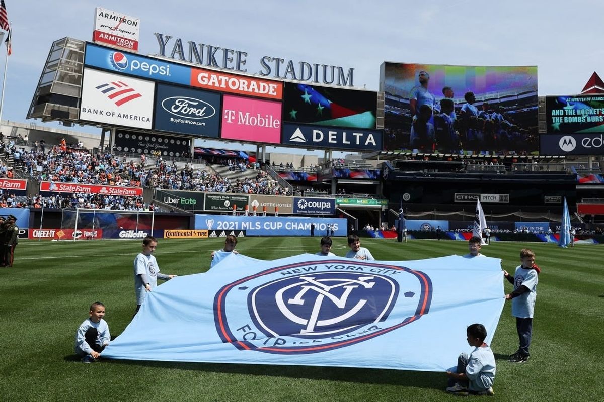May 1, 2022; New York, New York, USA; Young fans hold a New York City FC banner on the pitch before the game against the San Jose Earthquakes at Yankee Stadium.