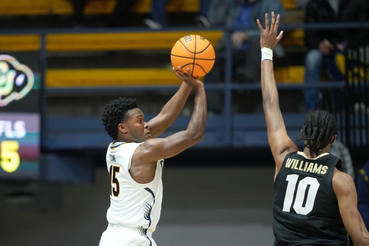 Jan 10, 2024; Berkeley, California, USA; California Golden Bears guard Jalen Cone (15) shoots against Colorado Buffaloes forward Cody Williams (10) during the first half at Haas Pavilion.