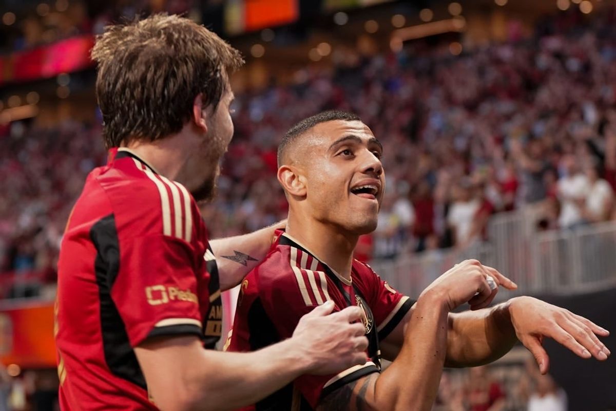 Mar 31, 2024; Atlanta, Georgia, USA; Atlanta United forward Giorgos Giakoumakis (7) celebrates with midfielder Saba Lobjanidze (9) after scoring a goal against Chicago Fire FC during the first half at Mercedes-Benz Stadium.