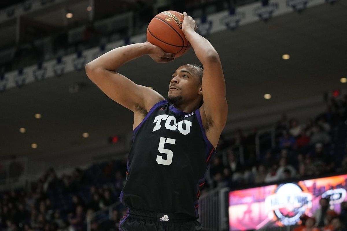 Dec 9, 2023; Toronto, Ontario, CAN; TCU Horned Frogs forward Chuck O'Bannon Jr. (5) goes to shoot a basket against Clemson Tigers during the first half at Coca-Cola Coliseum.
