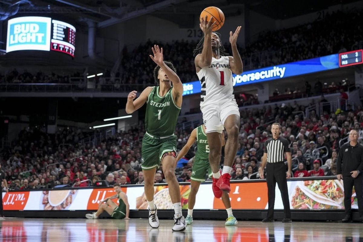 Dec 22, 2023; Cincinnati, Ohio, USA;  Cincinnati Bearcats forward Day Day Thomas (1) drives to the basket against Stetson Hatters guard Tristan Gross (1) in the first half at Fifth Third Arena.