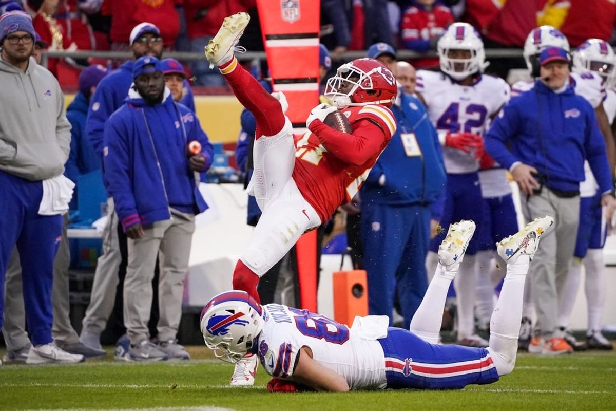 Dec 10, 2023; Kansas City, Missouri, USA; Kansas City Chiefs safety Chamarri Conner (27) intercepts a pass intended for Buffalo Bills tight end Dalton Kincaid (86) during the first half at GEHA Field at Arrowhead Stadium.