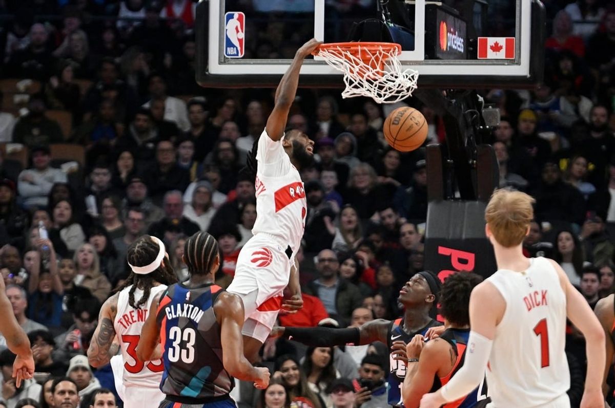 Mar 25, 2024; Toronto, Ontario, CAN;  Toronto Raptors guard Javon Freeman-Liberty (0) dunks against the Brooklyn Nets in the first half at Scotiabank Arena.