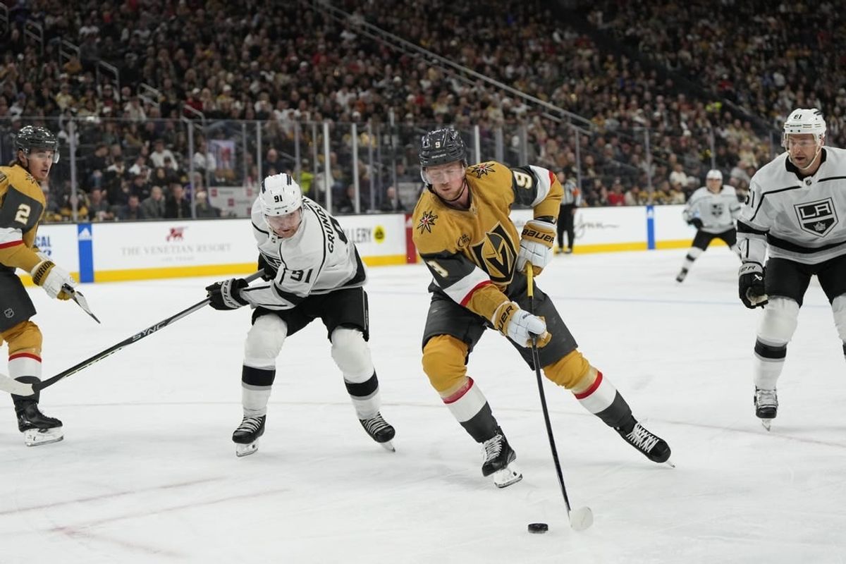 Dec 28, 2023; Las Vegas, Nevada, USA; Vegas Golden Knights center Jack Eichel (9) skates with the puck against Los Angeles Kings right wing Carl Grundstrom (91) during the first period at T-Mobile Arena.