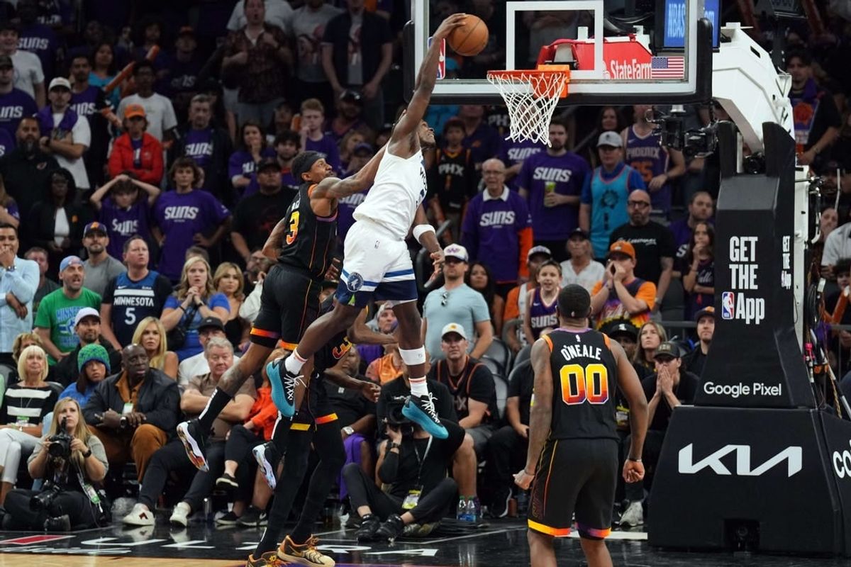 Apr 28, 2024; Phoenix, Arizona, USA; Minnesota Timberwolves guard Anthony Edwards (5) dunks against the Phoenix Suns during the second half of game four of the first round for the 2024 NBA playoffs at Footprint Center.