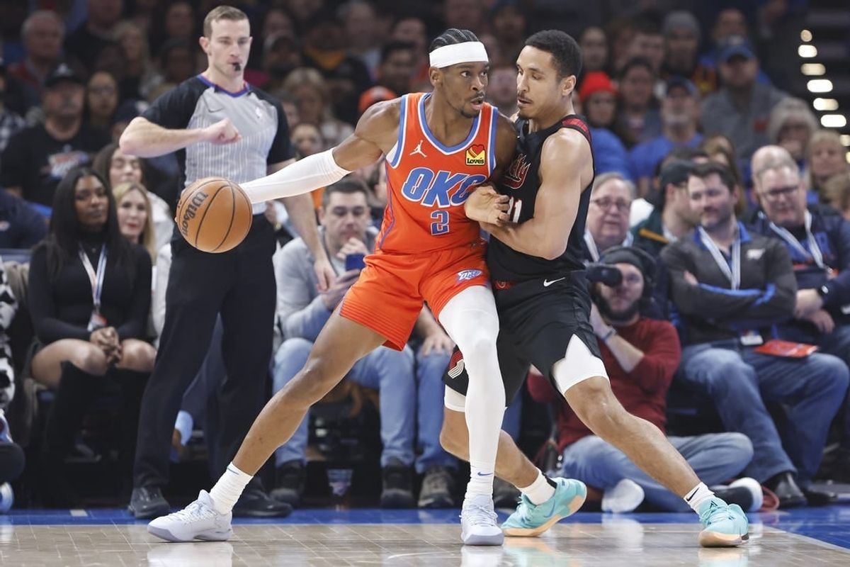 Jan 23, 2024; Oklahoma City, Oklahoma, USA; Oklahoma City Thunder guard Shai Gilgeous-Alexander (2) drives against Portland Trail Blazers guard Malcolm Brogdon (11) during the first quarter at Paycom Center.