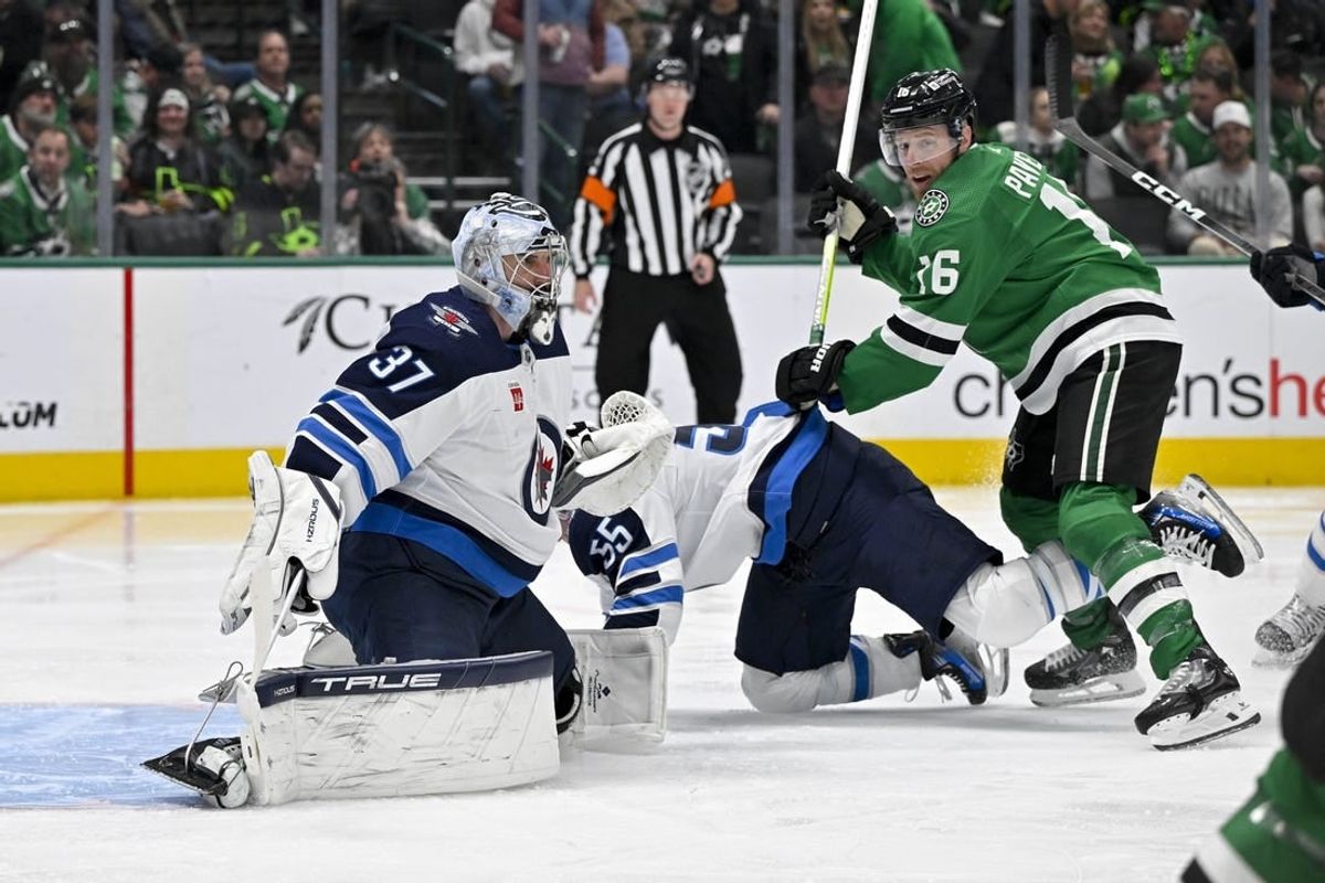 Feb 29, 2024; Dallas, Texas, USA; Dallas Stars center Joe Pavelski (16) checks Winnipeg Jets center Mark Scheifele (55) as goaltender Connor Hellebuyck (37) looks for the puck in the Jets zone during the second period at the American Airlines Center.