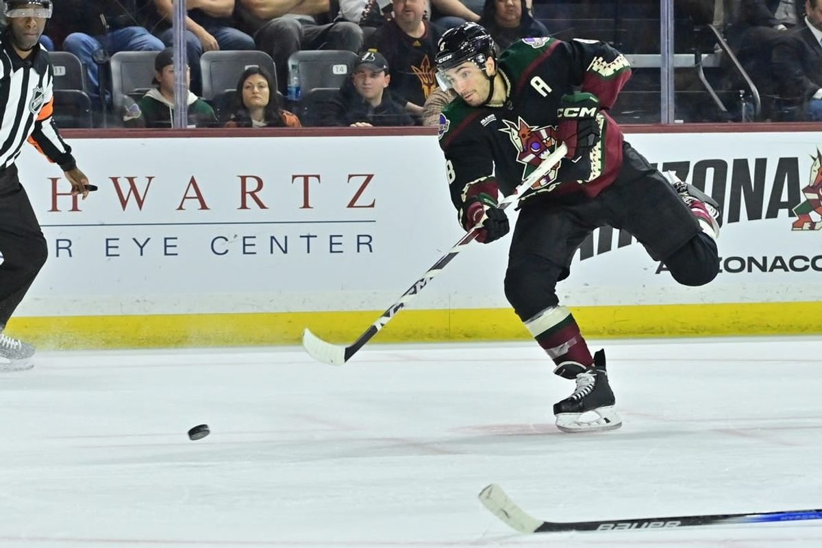 Apr 3, 2024; Tempe, Arizona, USA; Arizona Coyotes center Nick Schmaltz (8) shoots the puck in the second period against the Vancouver Canucks at Mullett Arena.